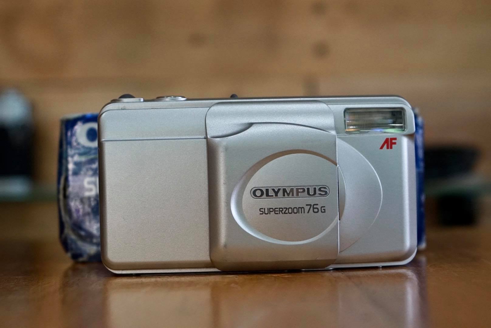 OLYMPUS SUPERZOOM 76G OLYMPUS LENS ZOOM 38-76MM.
