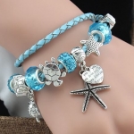 สร้อยข้อมือ Diy สร้อยข้อมือ สไตล์ แพนโดร่า สายหนัง ร้อย ลูกปัดคริสตัลใส สีฟ้า ธีมทะเล จี้ เต่าทะเล ปลาดาว ของขวัญให้แฟน สวย ๆ 253340