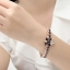 สร้อยข้อมือ ผู้หญิง สร้อยข้อมือทอง 18 K คริสตัลแท้ พลอยสีนิล สลับ เพชร CZ AAA สุดหรู ดีไซน์ เป็นลายดอกไม้ ใส่ออกงาน ราตรี เข้ากับ เดรสสีดำ 892524